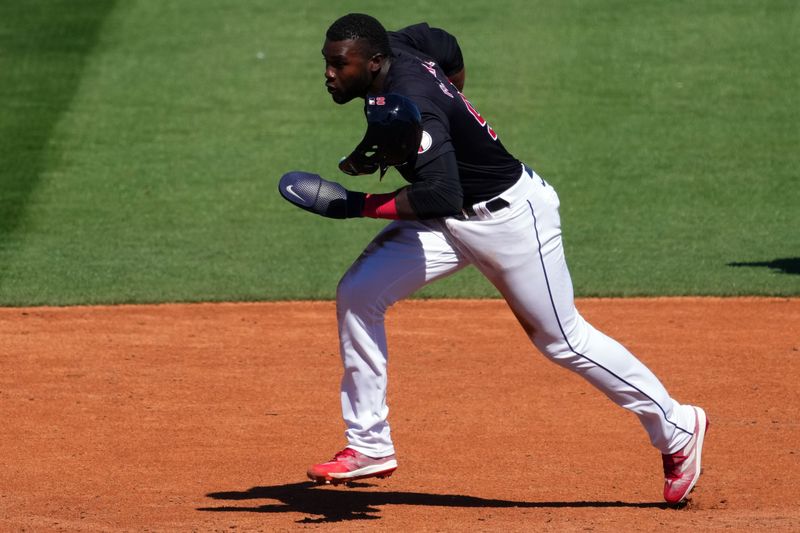 Mar 2, 2024; Goodyear, Arizona, USA; Cleveland Guardians right fielder Estevan Florial (90) runs to third base against the Kansas City Royals during the second inning at Goodyear Ballpark. Mandatory Credit: Joe Camporeale-USA TODAY Sports