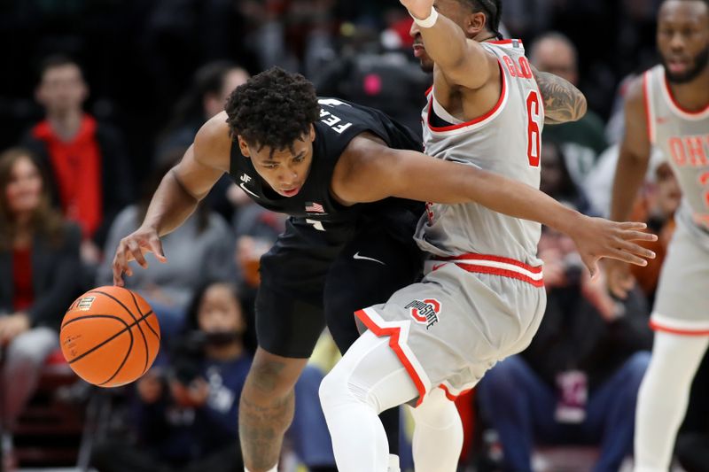 Jan 3, 2025; Columbus, Ohio, USA; Ohio State Buckeyes guard Ques Glover (6) defends Michigan State Spartans guard Jeremy Fears Jr. (1) during the second half at Value City Arena. Mandatory Credit: Joseph Maiorana-Imagn Images