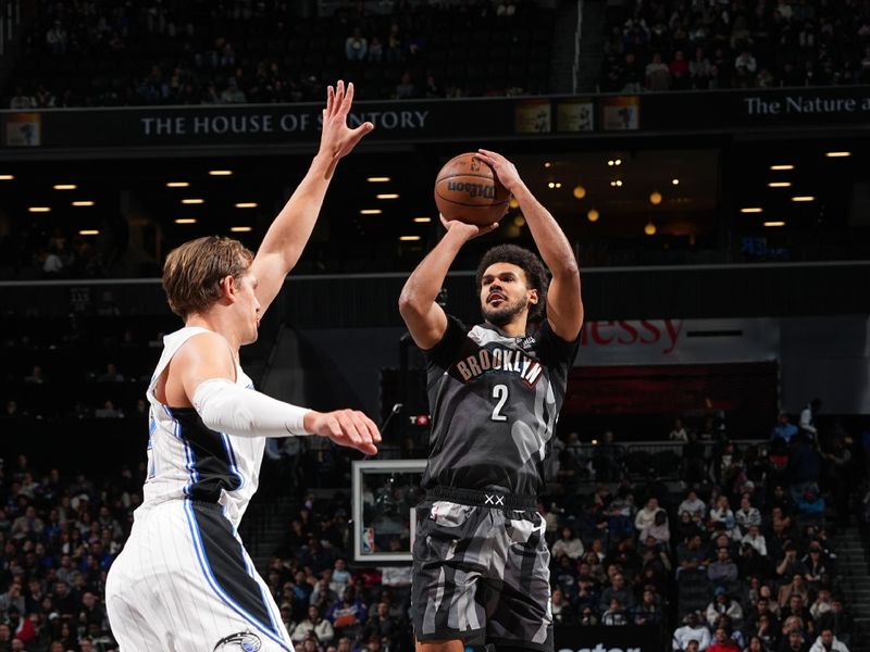 BROOKLYN, NY - DECEMBER 1: Cameron Johnson #2 of the Brooklyn Nets shoots a three point basket during the game  against the Orlando Magic on December 1, 2024 at Barclays Center in Brooklyn, New York. NOTE TO USER: User expressly acknowledges and agrees that, by downloading and or using this Photograph, user is consenting to the terms and conditions of the Getty Images License Agreement. Mandatory Copyright Notice: Copyright 2024 NBAE (Photo by Jesse D. Garrabrant/NBAE via Getty Images)