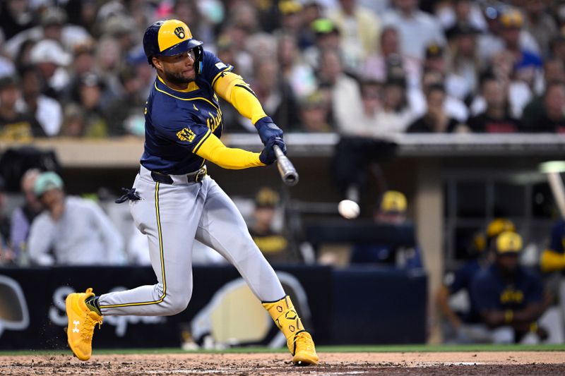 Jun 21, 2024; San Diego, California, USA; Milwaukee Brewers right fielder Jackson Chourio (11) hits a single against the San Diego Padres during the fifth inning at Petco Park. Mandatory Credit: Orlando Ramirez-USA TODAY Sports