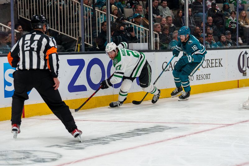 Jan 18, 2023; San Jose, California, USA;  Dallas Stars left wing Mason Marchment (27) controls the puck against San Jose Sharks center Steven Lorentz (16) during the third period at SAP Center at San Jose. Mandatory Credit: Neville E. Guard-USA TODAY Sports