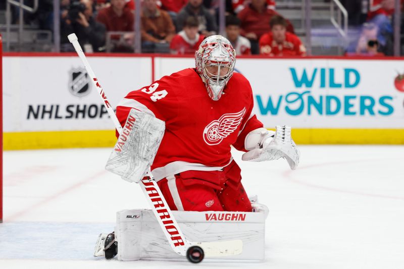 Feb 22, 2024; Detroit, Michigan, USA; Detroit Red Wings goaltender Alex Lyon (34) makes a save in the first period against the Colorado Avalanche at Little Caesars Arena. Mandatory Credit: Rick Osentoski-USA TODAY Sports