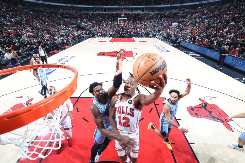 CHICAGO, IL - JANUARY 20: Ayo Dosunmu #12 of the Chicago Bulls drives to the basket during the game against the Memphis Grizzlies on January 20, 2024 at United Center in Chicago, Illinois. NOTE TO USER: User expressly acknowledges and agrees that, by downloading and or using this photograph, User is consenting to the terms and conditions of the Getty Images License Agreement. Mandatory Copyright Notice: Copyright 2024 NBAE (Photo by Jeff Haynes/NBAE via Getty Images)