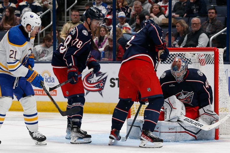 Feb 23, 2024; Columbus, Ohio, USA; Columbus Blue Jackets goalie Daniil Tarasov (40) makes a save as Buffalo Sabres left wing Kyle Okposo (21) looks for a rebound during the second period at Nationwide Arena. Mandatory Credit: Russell LaBounty-USA TODAY Sports