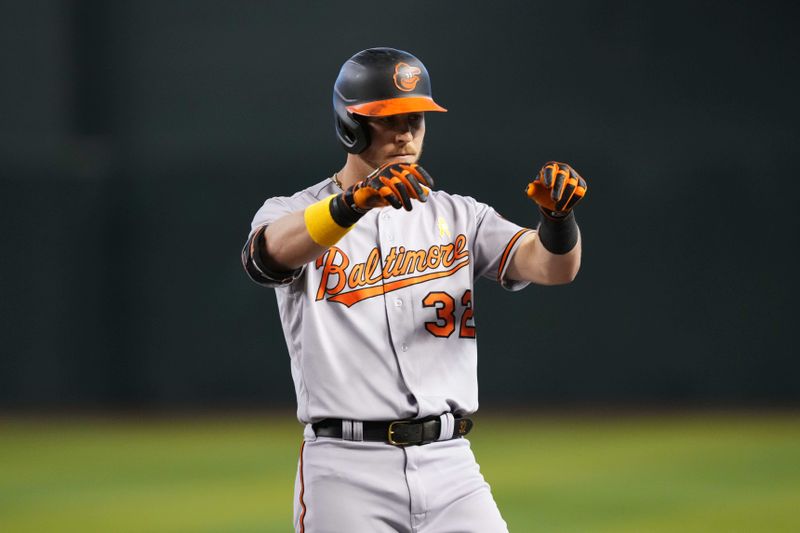 Sep 3, 2023; Phoenix, Arizona, USA; Baltimore Orioles first baseman Ryan O'Hearn (32) reacts after hitting an RBI single against the Arizona Diamondbacks during the first inning at Chase Field. Mandatory Credit: Joe Camporeale-USA TODAY Sports