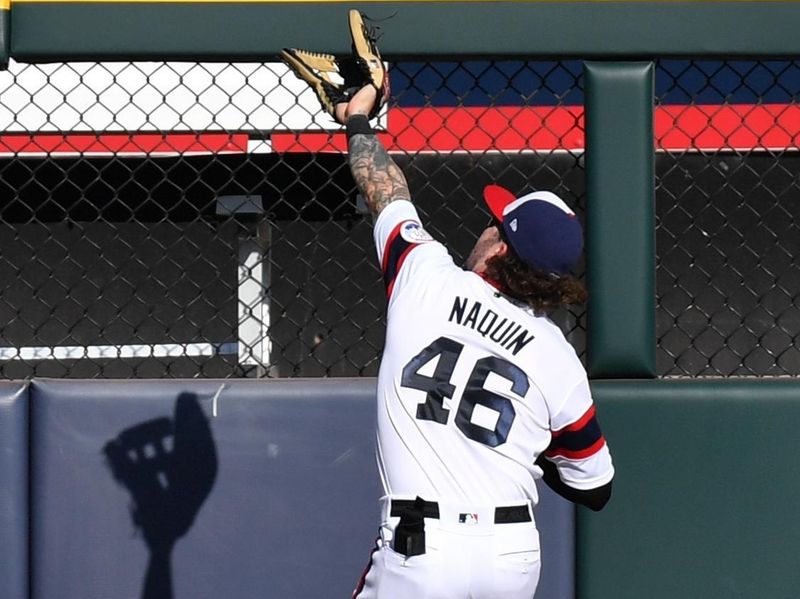 Oct 1, 2023; Chicago, Illinois, USA; Chicago White Sox left fielder Tyler Naquin (46) catches a fly ball near the warning track during the sixth inning against the San Diego Padres at Guaranteed Rate Field. Mandatory Credit: Patrick Gorski-USA TODAY Sports