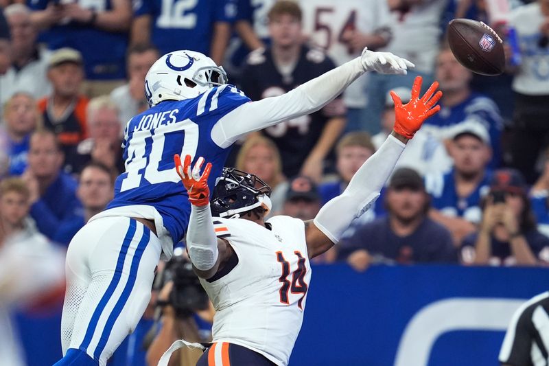 Indianapolis Colts cornerback Jaylon Jones (40) tips the ball away from Chicago Bears tight end Gerald Everett (14) during the first half of an NFL football game Sunday, Sept. 22, 2024, in Indianapolis. (AP Photo/Michael Conroy)