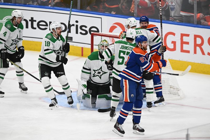 Jun 2, 2024; Edmonton, Alberta, CAN; Edmonton Oilers centre Connor McDavid (97) celebrates his goal on Dallas Stars goalie Jake Oettinger (29) during the first period in game six of the Western Conference Final of the 2024 Stanley Cup Playoffs at Rogers Place. Mandatory Credit: Walter Tychnowicz-USA TODAY Sports