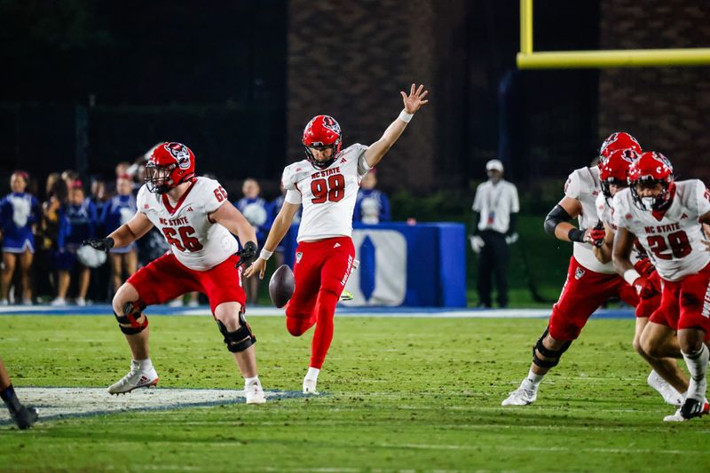 Oct 14, 2023; Durham, North Carolina, USA; North Carolina State Wolfpack punter Caden Noonkester (98) kicks the football during the first half of the game against Duke Blue Devils at Wallace Wade Stadium. Mandatory Credit: Jaylynn Nash-USA TODAY Sports