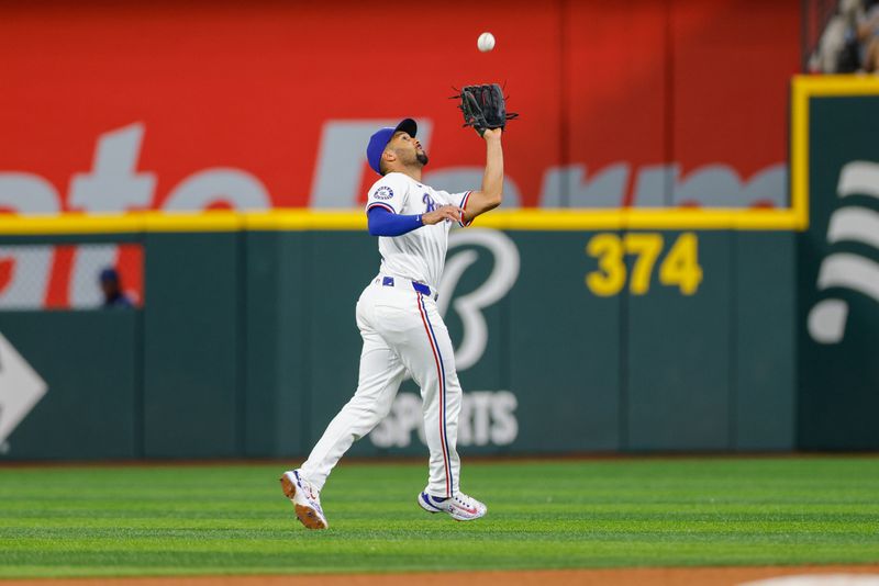 Jul 23, 2024; Arlington, Texas, USA; Texas Rangers second base Marcus Semien (2) makes a catch during the fifth inning against the Chicago White Sox at Globe Life Field. Mandatory Credit: Andrew Dieb-USA TODAY Sports