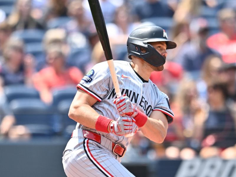 Aug 3, 2025; Cleveland, Ohio, USA; Minnesota Twins left fielder Trevor Larnach (9) hits an RBI single during the first inning against the Cleveland Guardians at Progressive Field. Mandatory Credit: Ken Blaze-Imagn Images