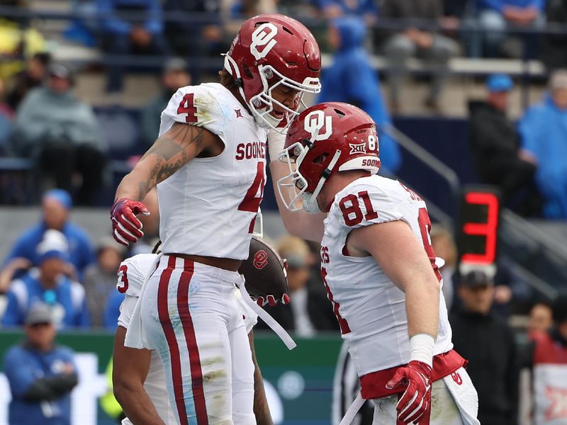 Nov 18, 2023; Provo, Utah, USA; Oklahoma Sooners wide receiver Nic Anderson (4) celebrates a first down with Oklahoma Sooners tight end Austin Stogner (81) against the Brigham Young Cougars in the first quarter at LaVell Edwards Stadium. Mandatory Credit: Rob Gray-USA TODAY Sports