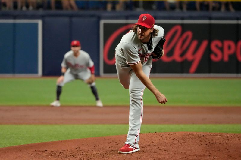 Jul 4, 2023; St. Petersburg, Florida, USA; Philadelphia Phillies starting pitcher Aaron Nola (27) throws a pitch against the Tampa Bay Rays during the third inning at Tropicana Field. Mandatory Credit: Dave Nelson-USA TODAY Sports