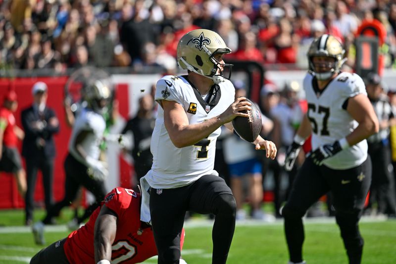 New Orleans Saints quarterback Derek Carr (4) scrambles in the first half of an NFL football game against the Tampa Bay Buccaneers in Tampa, Fla., Sunday, Dec. 31, 2023. (AP Photo/Jason Behnken)