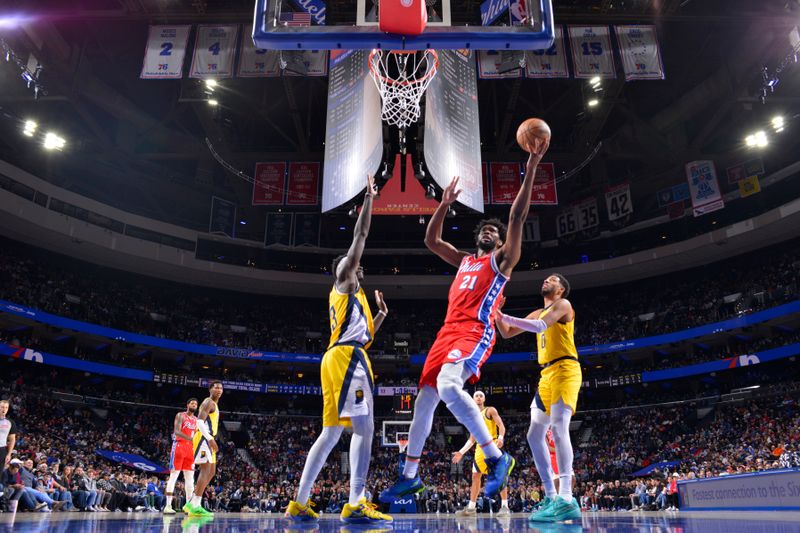 PHILADELPHIA, PA - DECEMBER 13: Joel Embiid #21 of the Philadelphia 76ers drives to the basket during the game against the Indiana Pacers on December 13, 2024 at the Wells Fargo Center in Philadelphia, Pennsylvania NOTE TO USER: User expressly acknowledges and agrees that, by downloading and/or using this Photograph, user is consenting to the terms and conditions of the Getty Images License Agreement. Mandatory Copyright Notice: Copyright 2024 NBAE (Photo by Jesse D. Garrabrant/NBAE via Getty Images)