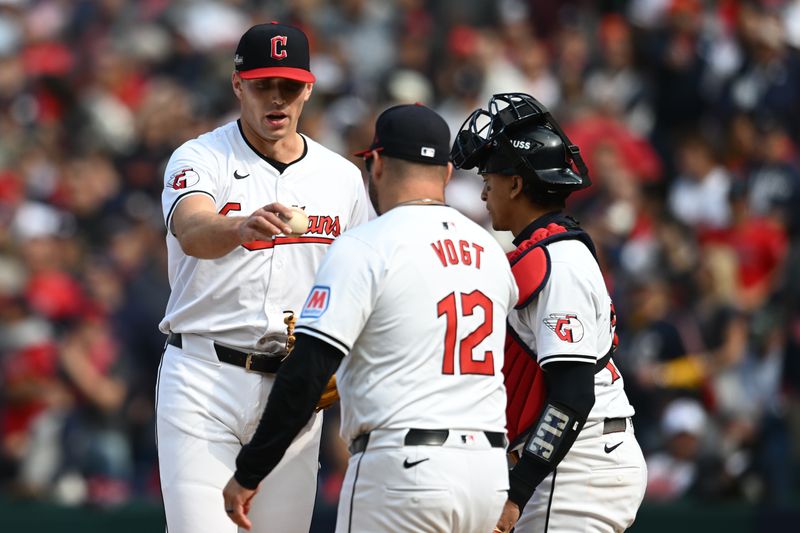 Oct 12, 2024; Cleveland, Ohio, USA; Cleveland Guardians manager Stephen Vogt (12) relieves relief pitcher Cade Smith (36) in the fourth inning against the Detroit Tigers during game five of the ALDS for the 2024 MLB Playoffs at Progressive Field. Mandatory Credit: Ken Blaze-Imagn Images