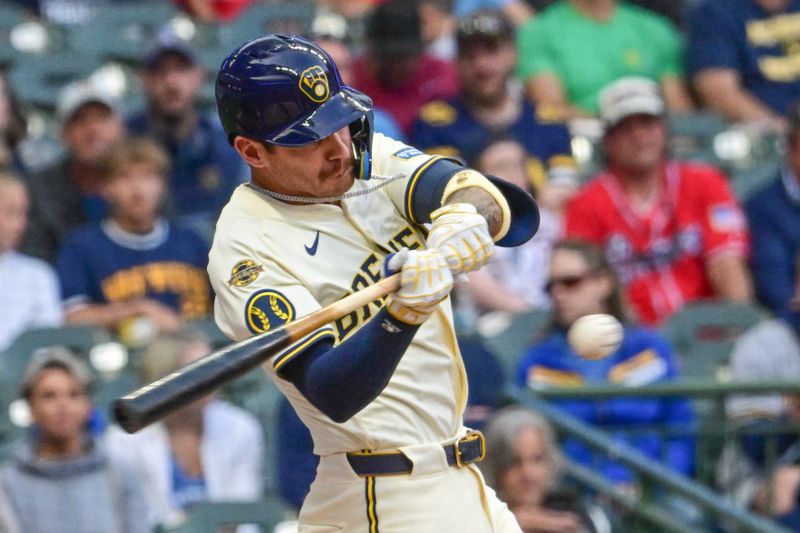 Jun 10, 2025; Milwaukee, Wisconsin, USA;  Milwaukee Brewers shortstop Joseph Ortiz (3) hits a single in the third inning against the Atlanta Braves at American Family Field. Mandatory Credit: Benny Sieu-Imagn Images