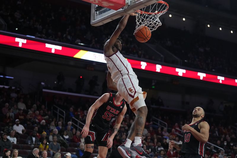 January 14, 2023; Los Angeles, California, USA; Southern California Trojans guard Reese Dixon-Waters (2) dunks the ball against Utah Utes guard Gabe Madsen (55) in the second half at Galen Center. Mandatory Credit: Kirby Lee-USA TODAY Sports