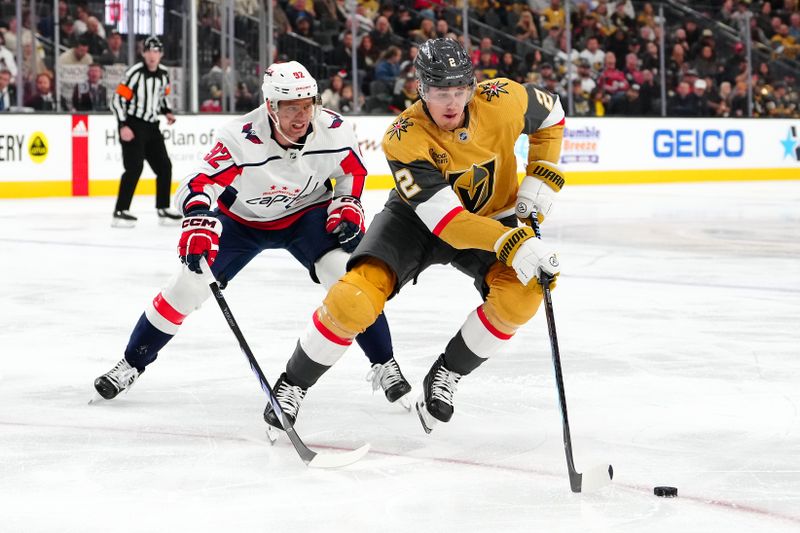 Dec 2, 2023; Las Vegas, Nevada, USA; Vegas Golden Knights defenseman Zach Whitecloud (2) skates ahead of Washington Capitals center Evgeny Kuznetsov (92) during the second period at T-Mobile Arena. Mandatory Credit: Stephen R. Sylvanie-USA TODAY Sports