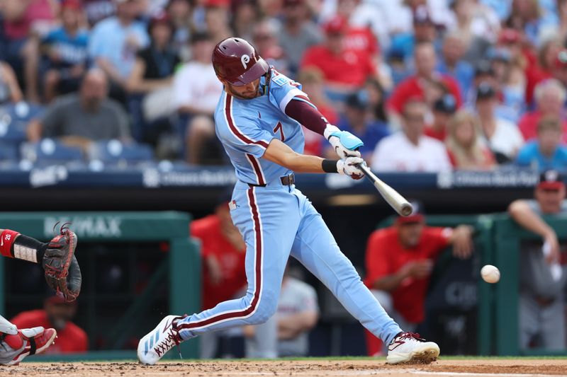 Aug 15, 2024; Philadelphia, Pennsylvania, USA; Philadelphia Phillies shortstop Trea Turner (7) hits a single during the first inning against the Washington Nationals at Citizens Bank Park. Mandatory Credit: Bill Streicher-USA TODAY Sports