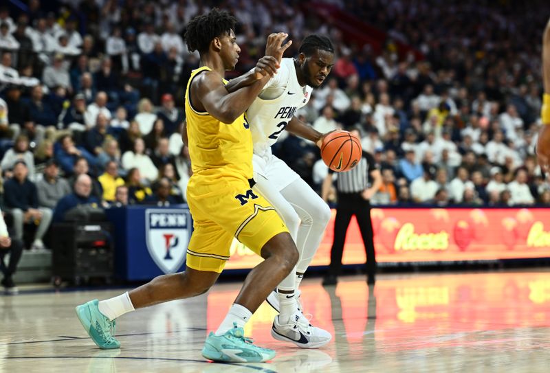 Jan 7, 2024; Philadelphia, Pennsylvania, USA; Penn State Nittany Lions forward Qudus Wahab (22) drives against Michigan Wolverines forward Tarris Reed Jr (32) in the first half at The Palestra. Mandatory Credit: Kyle Ross-USA TODAY Sports