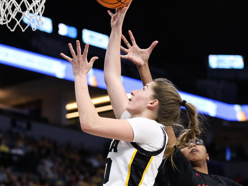 Mar 4, 2023; Minneapolis, MINN, USA; Iowa Hawkeyes guard Kate Martin (20) shoots while Maryland Terrapins guard Shyanne Sellers (0) defends during the first half at Target Center. Mandatory Credit: Matt Krohn-USA TODAY Sports