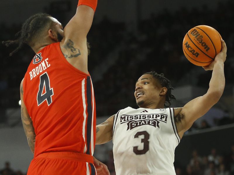 Jan 27, 2024; Starkville, Mississippi, USA; Mississippi State Bulldogs guard Shakeel Moore (3) passes the ball as Auburn Tigers forward/center Johni Broome (4) defends during the second half at Humphrey Coliseum. Mandatory Credit: Petre Thomas-USA TODAY Sports