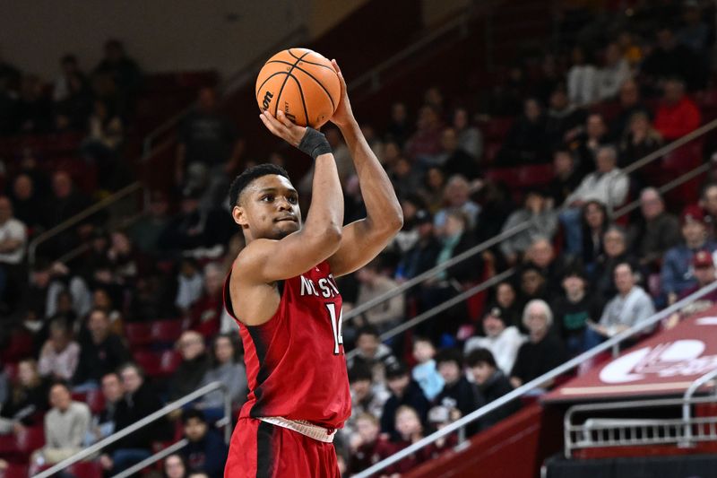 Feb 11, 2023; Chestnut Hill, Massachusetts, USA; North Carolina State Wolfpack guard Casey Morsell (14) attempts a three point basket against the Boston College Eagles during the second half at the Conte Forum. Mandatory Credit: Brian Fluharty-USA TODAY Sports