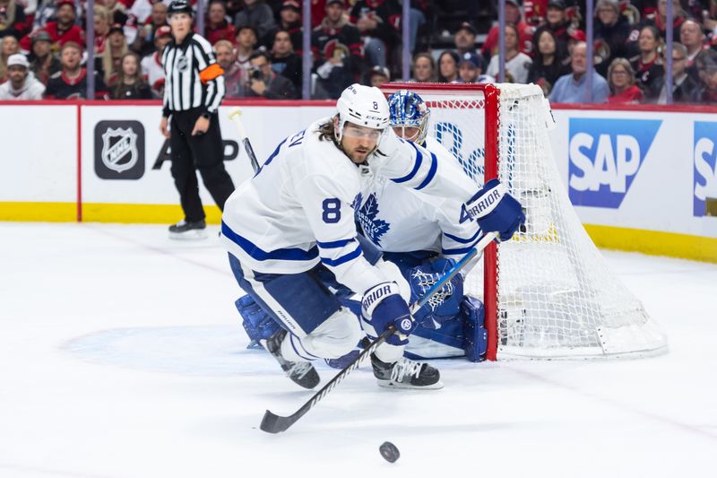 May 1, 2025; Ottawa, Ontario, CAN; Toronto Maple Leafs defenseman Christopher Tanev (8) chases the puck in game six of the first round of the 2025 Stanley Cup Playoffs against the Ottawa Senators at Canadian Tire Centre. Mandatory Credit: Marc DesRosiers-Imagn Images