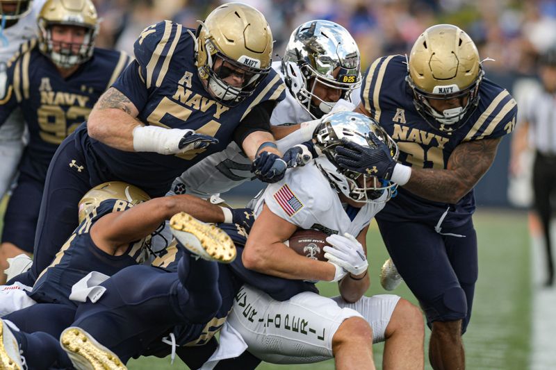 Oct 21, 2023; Annapolis, Maryland, USA; Air Force Falcons wide receiver Dane Kinamon (23) is swarmed by Navy Midshipmen defense during the first half  at Navy-Marine Corps Memorial Stadium. Mandatory Credit: Tommy Gilligan-USA TODAY Sports