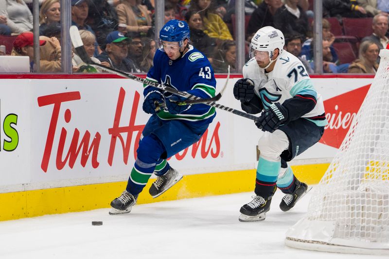 Sep 29, 2022; Vancouver, British Columbia, CAN; Seattle Kraken forward Joonas Donskoi (72) plays for the puck against Vancouver Canucks defenseman Quinn Hughes (43) in the second period at Rogers Arena. Mandatory Credit: Bob Frid-USA TODAY Sports