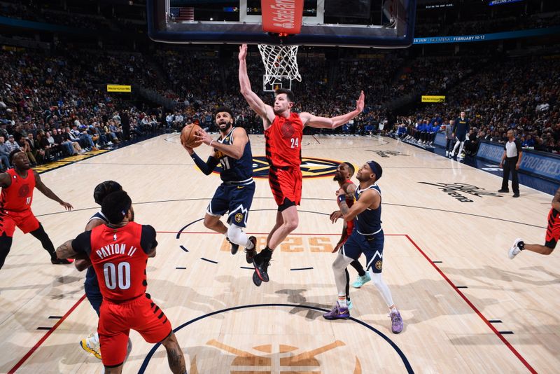 DENVER, CO - JANUARY 17: Jamal Murray #27 of the Denver Nuggets drives to the basket during the game against the Portland Trail Blazers on January 17, 2023 at the Ball Arena in Denver, Colorado. NOTE TO USER: User expressly acknowledges and agrees that, by downloading and/or using this Photograph, user is consenting to the terms and conditions of the Getty Images License Agreement. Mandatory Copyright Notice: Copyright 2023 NBAE (Photo by Garrett Ellwood/NBAE via Getty Images)