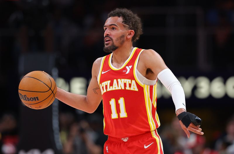 ATLANTA, GEORGIA - APRIL 10:  Trae Young #11 of the Atlanta Hawks runs the offense against the Charlotte Hornets during the second quarter at State Farm Arena on April 10, 2024 in Atlanta, Georgia.  NOTE TO USER: User expressly acknowledges and agrees that, by downloading and/or using this photograph, user is consenting to the terms and conditions of the Getty Images License Agreement.  (Photo by Kevin C. Cox/Getty Images)