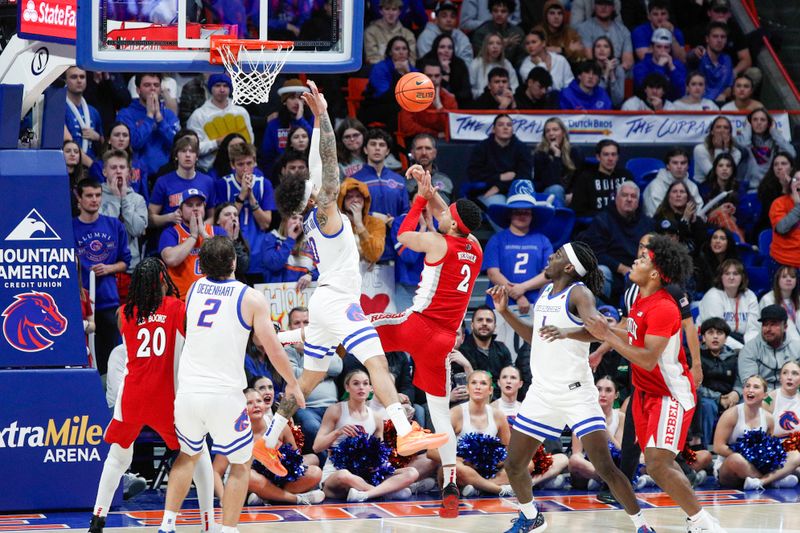 Jan 16, 2024; Boise, Idaho, USA; UNLV Rebels guard Justin Webster (2) shoots over Boise State Broncos guard Roddie Anderson III (0) during the second half  at ExtraMile Arena. UNLV beats Boise State 68-64. Mandatory Credit: Brian Losness-USA TODAY Sports

