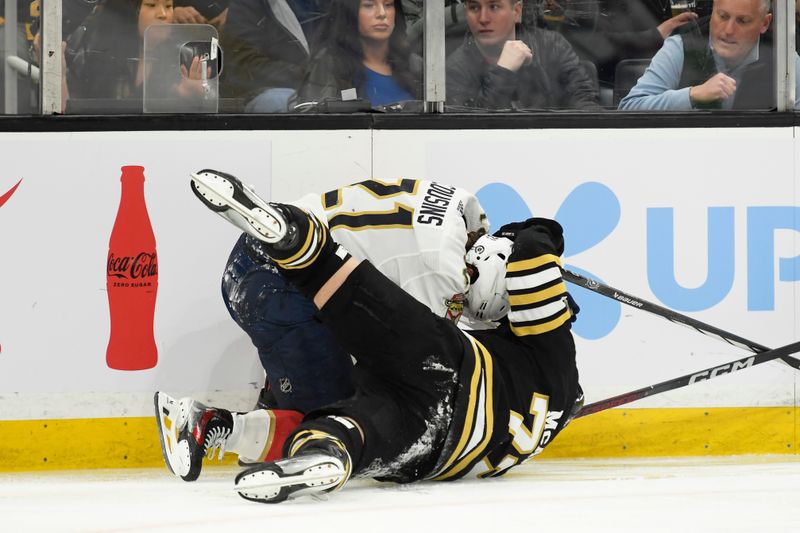 Apr 6, 2024; Boston, Massachusetts, USA; Florida Panthers center Nick Cousins (21) battles with Boston Bruins defenseman Charlie McAvoy (73) during the second period at TD Garden. Mandatory Credit: Bob DeChiara-USA TODAY Sports