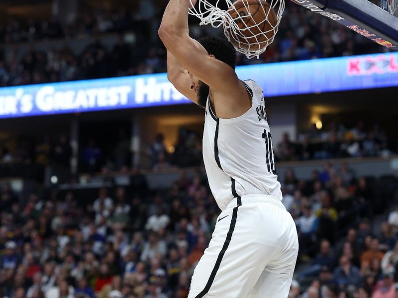 DENVER, COLORADO - JANUARY 10: Ben Simmons #10 of the Brooklyn Nets dunks against the Denver Nuggets in the first quarter at Ball Arena on January 10, 2025 in Denver, Colorado.NOTE TO USER: User expressly acknowledges and agrees that, by downloading and or using this photograph, User is consenting to the terms and conditions of the Getty Images License Agreement. (Photo by Matthew Stockman/Getty Images)