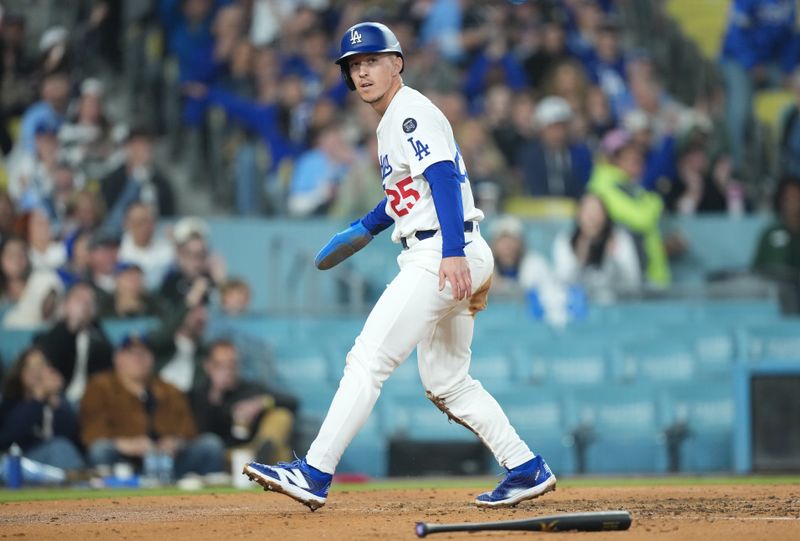 Apr 29, 2025; Los Angeles, California, USA; Los Angeles Dodgers second baseman Tommy Edman (25) celebrates after scoring against the Miami Marlins during the third inning at Dodger Stadium. Mandatory Credit: Kirby Lee-Imagn Images