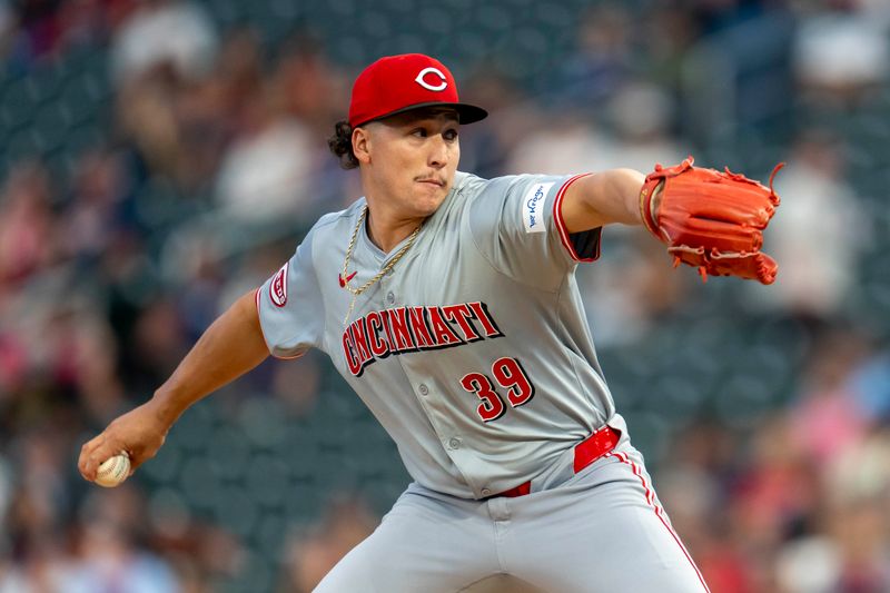 Sep 13, 2024; Minneapolis, Minnesota, USA; Cincinnati Reds starting pitcher Julian Aguiar (39) delivers a pitch against the Minnesota Twins in the first inning at Target Field. Mandatory Credit: Jesse Johnson-Imagn Images