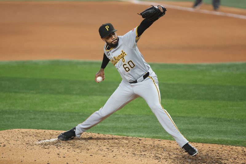 Aug 19, 2024; Arlington, Texas, USA; Pittsburgh Pirates pitcher Dennis Santana (60) throws a pitch in the eighth inning against the Texas Rangers at Globe Life Field. Mandatory Credit: Tim Heitman-USA TODAY Sports
