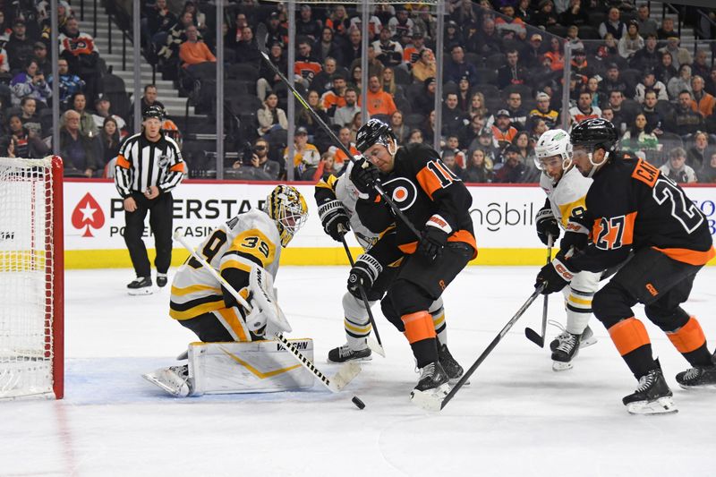 Feb 25, 2025; Philadelphia, Pennsylvania, USA; Philadelphia Flyers left wing Noah Cates (27) scores a goal against Pittsburgh Penguins goaltender Alex Nedeljkovic (39) during the second period at Wells Fargo Center. Mandatory Credit: Eric Hartline-Imagn Images