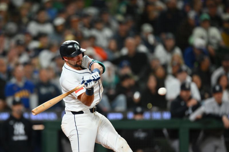 May 12, 2025; Seattle, Washington, USA; Seattle Mariners catcher Cal Raleigh (29) hits a 2-run home run against the New York Yankees during the eighth inning at T-Mobile Park. Mandatory Credit: Steven Bisig-Imagn Images