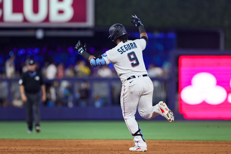 Jul 30, 2023; Miami, Florida, USA; Miami Marlins third baseman Jean Segura (9) circles the bases after hitting a solo home run against the Detroit Tigers during the eighth inning at loanDepot Park. Mandatory Credit: Sam Navarro-USA TODAY Sports