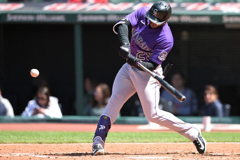 Apr 26, 2023; Cleveland, Ohio, USA; Colorado Rockies left fielder Jurickson Profar (29) hits a double during the sixth inning against the Cleveland Guardians at Progressive Field. Mandatory Credit: Ken Blaze-USA TODAY Sports