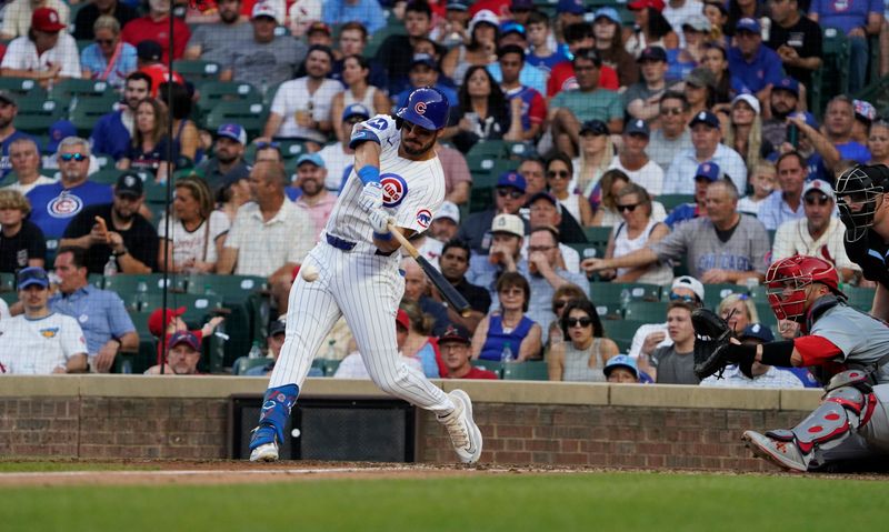 Aug 4, 2024; Chicago, Illinois, USA; Chicago Cubs outfielder Mike Tauchman (40) hits a double against the St. Louis Cardinals during the fourth inning at Wrigley Field. Mandatory Credit: David Banks-USA TODAY Sports