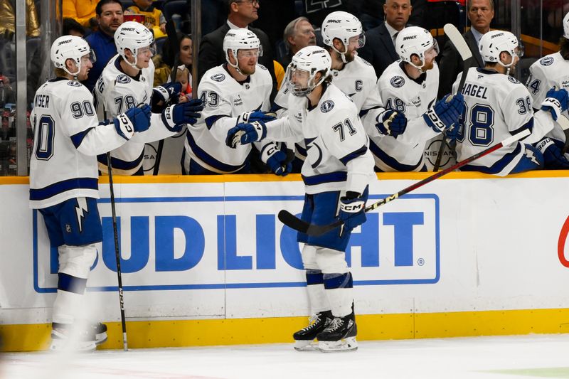 Nov 29, 2024; Nashville, Tennessee, USA;  Tampa Bay Lightning center Anthony Cirelli (71) celebrates his goal with his teammates  against the Nashville Predators during the second period at Bridgestone Arena. Mandatory Credit: Steve Roberts-Imagn Images