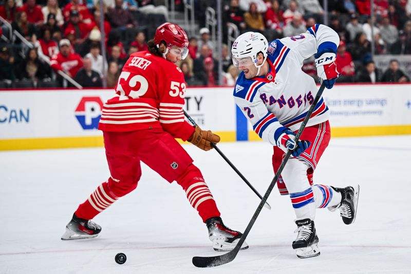 Nov 7, 2025; Detroit, Michigan, USA; New York Rangers center Jonny Brodzinski (22) brings the puck up ice against Detroit Red Wings defenseman Moritz Seider (53) during the first period at Little Caesars Arena. Mandatory Credit: Tim Fuller-Imagn Images
