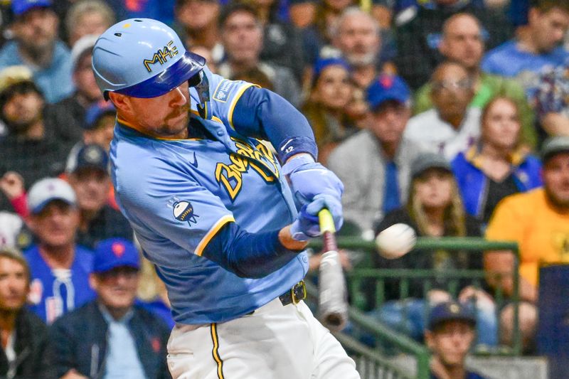 Sep 27, 2024; Milwaukee, Wisconsin, USA;  Milwaukee Brewers first baseman Rhys Hoskins (12) hits a grand slam home run against the New York Mets in the first inning at American Family Field. Mandatory Credit: Benny Sieu-Imagn Images