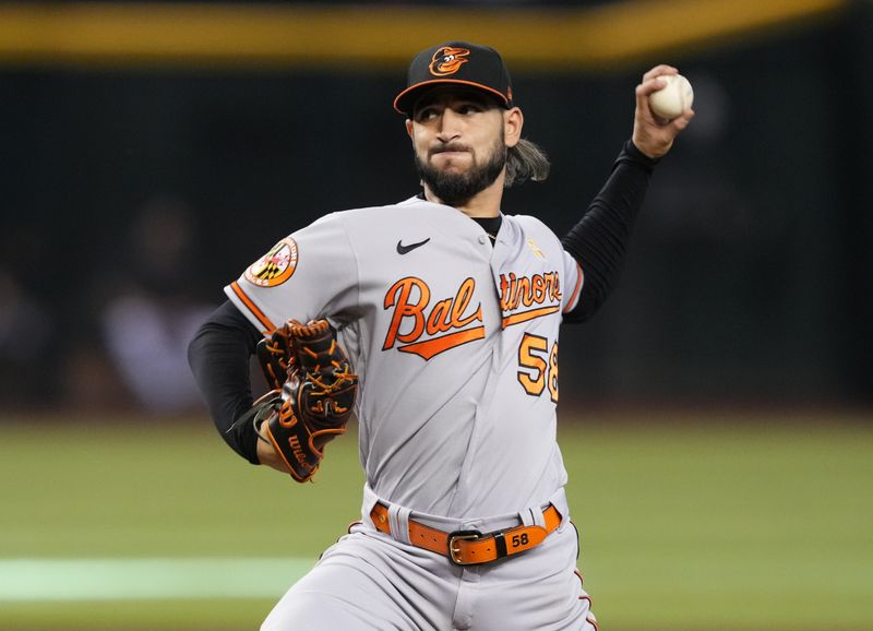 Sep 3, 2023; Phoenix, Arizona, USA; Baltimore Orioles relief pitcher Cionel Perez (58) pitches against the Arizona Diamondbacks during the seventh inning at Chase Field. Mandatory Credit: Joe Camporeale-USA TODAY Sports