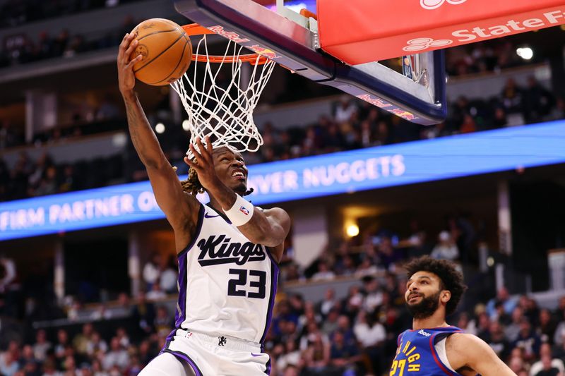DENVER, COLORADO - MARCH 5: Keon Ellis #23 of the Sacramento Kings goes to the basket against Jamal Murray #27 of the Denver Nuggets during the first quarter at Ball Arena on March 5, 2025 in Denver, Colorado. NOTE TO USER: User expressly acknowledges and agrees that, by downloading and/or using this Photograph, user is consenting to the terms and conditions of the Getty Images License Agreement. Mandatory Copyright Notice: Copyright 2025 NBAE (Photo by Tyler McFarland/Clarkson Creative/Getty Images)