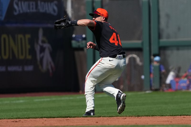 Mar 1, 2024; Scottsdale, Arizona, USA; San Francisco Giants shortstop Nick Ahmed (40) fields a ball against the Texas Rangers during the second inning at Scottsdale Stadium. Mandatory Credit: Joe Camporeale-USA TODAY Sports